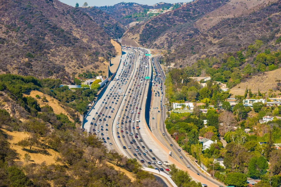 Traffic on the 405 interstate freeway through the Sepulveda Pass at Getty Center Drive in Los Angeles, California